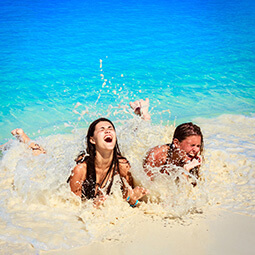 girls woman beach fun sand tropical blue sea splash real UGC travel content photography