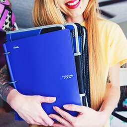 girl smiling pink lipstick holding binder blue school college branded UGC content